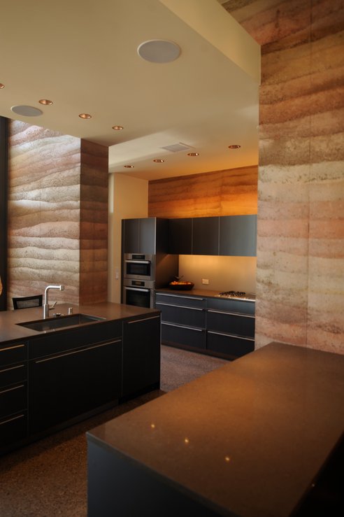 Thermal Mass, Careful Siting and Shading And Natural Ventilation Keep This Building Busy